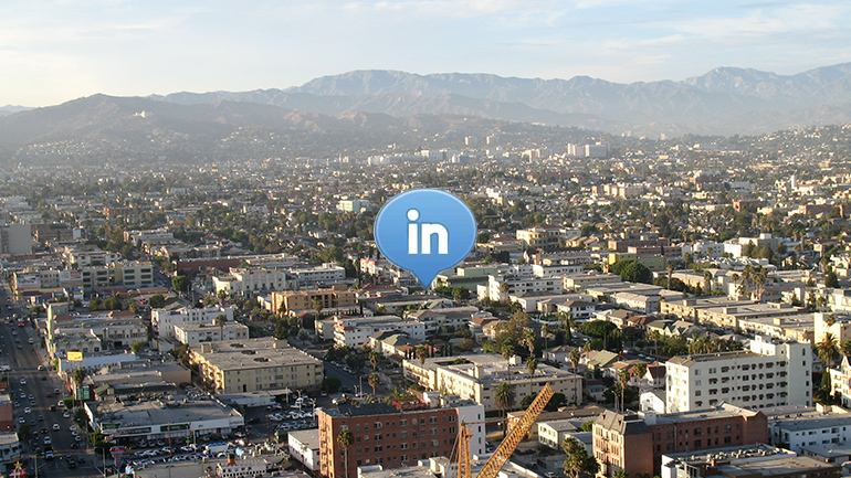 linkedin logo with photo of city in background