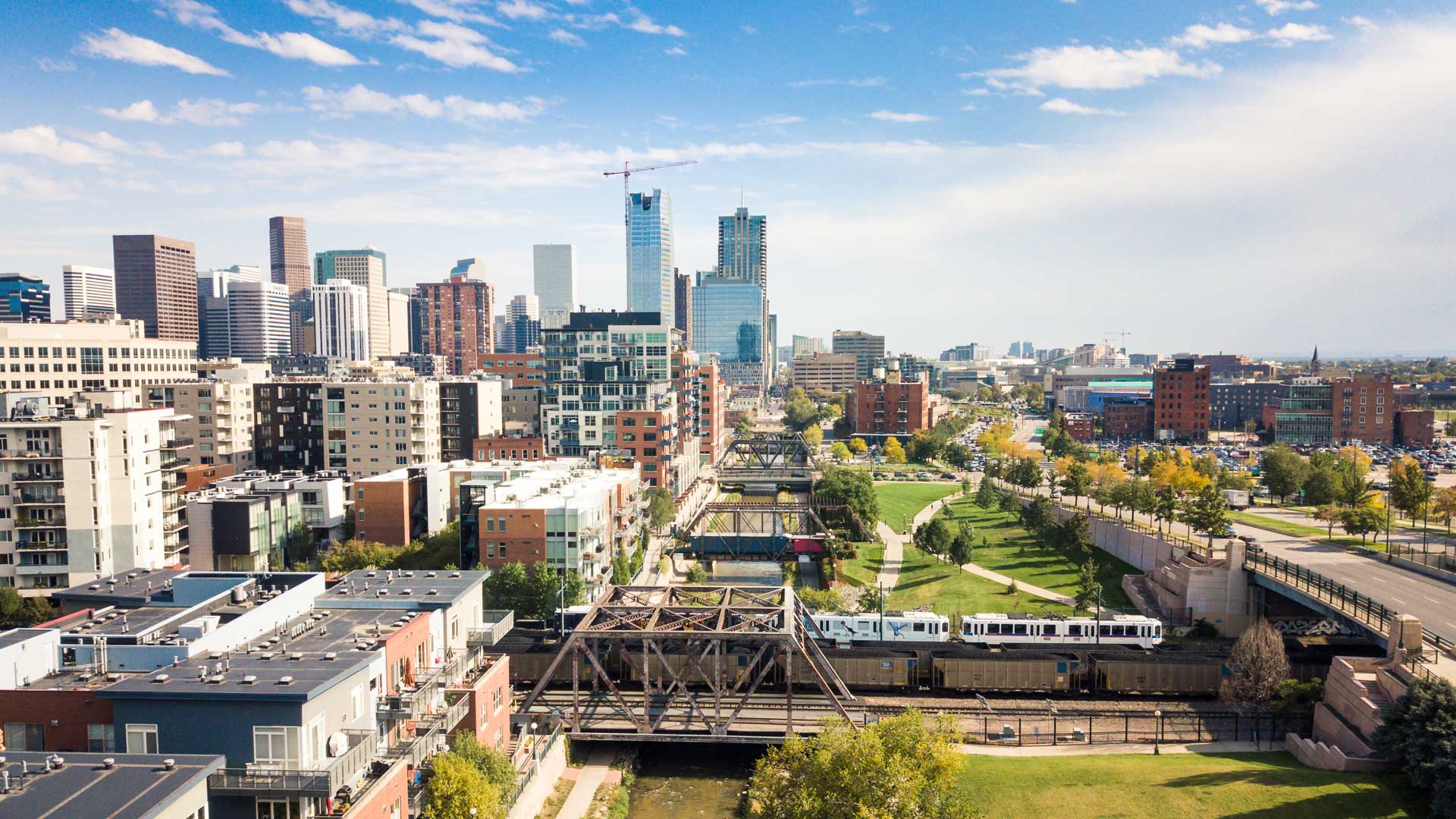 aerial of denver with buildings and transit