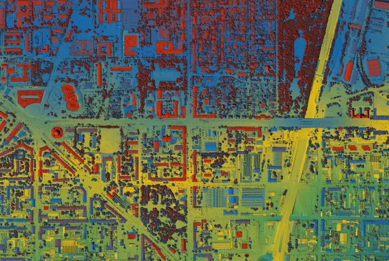 Sloan Campi Introduction to ARCGIS part 2 image of areial view of city heat map with saturated colors blue, green, yellow, purple, and red