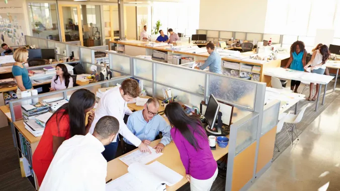 diverse co-workers working in an open office layout