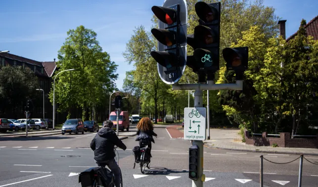cyclists navigate two-phase turn on dutch intersection