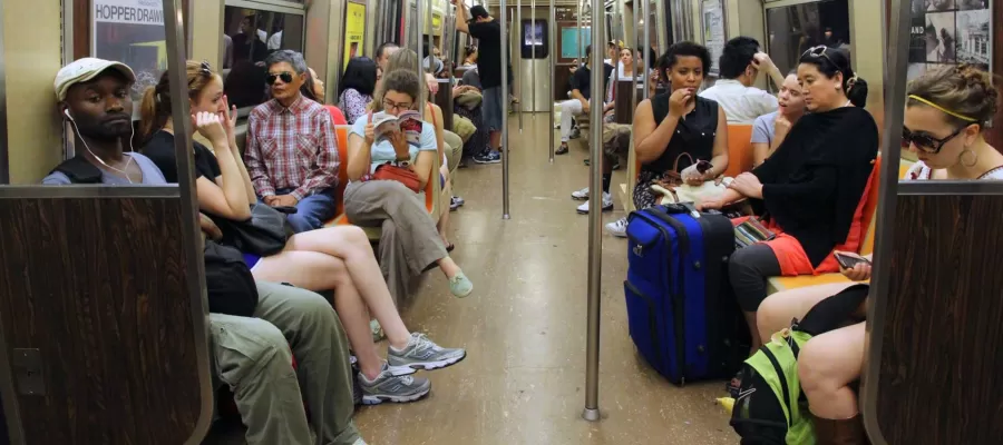 people sitting inside a New York subway car