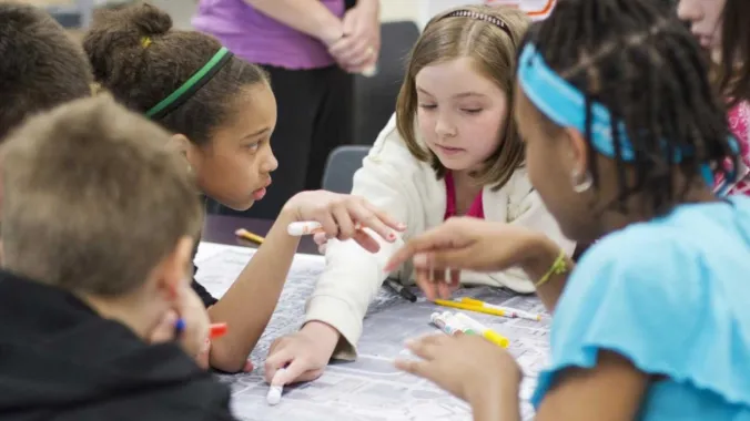 kids viewing map on table
