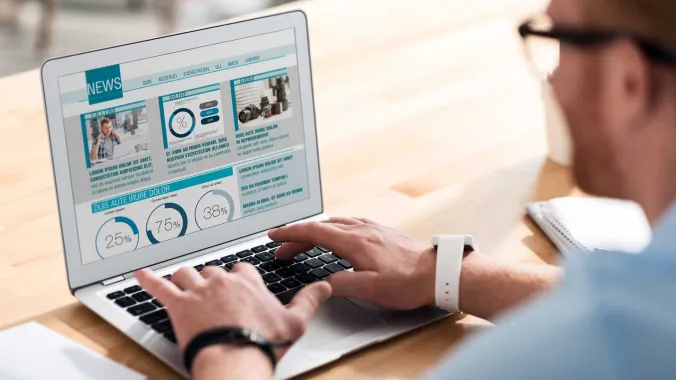 person publishing digital content on laptop