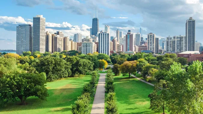 park with city skyline in background