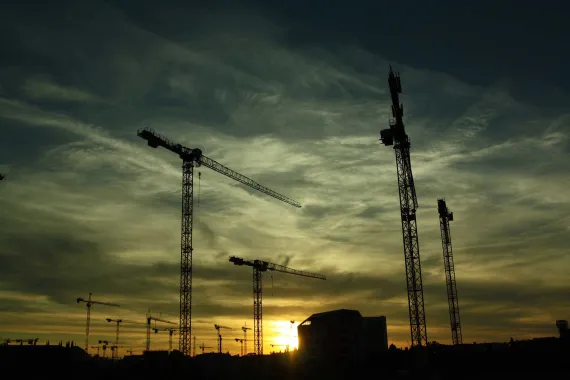 several cranes on construction site