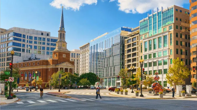 church surrounded by city buildings