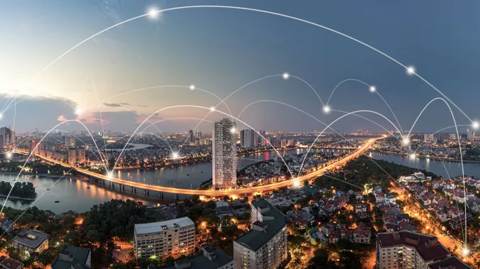 digital network connections over city skyline