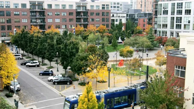 neighborhood with buildings and metro train