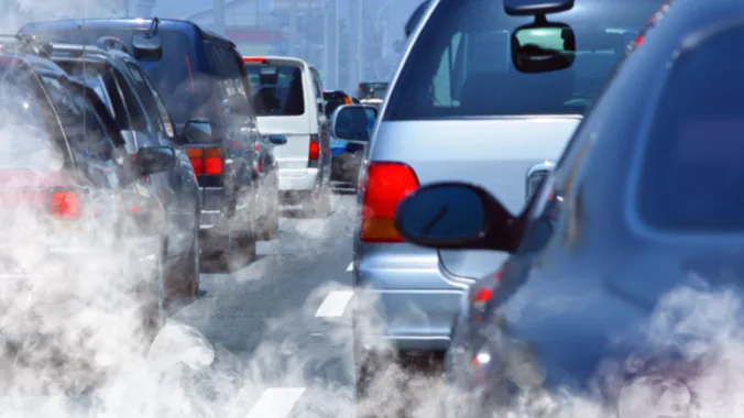 cars in traffic emitting pollution