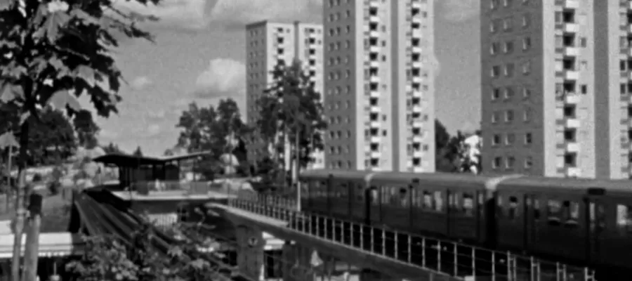 European city with train and buildings in black and white