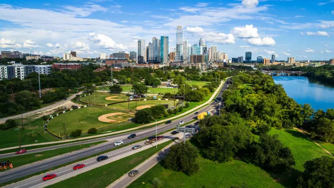 wide angle shot of Austin Texas with a freeway and city skyline