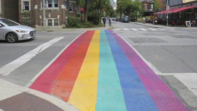 crosswalk intersection painted with rainbow colors