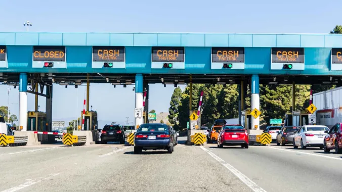 cars waiting at a toll road