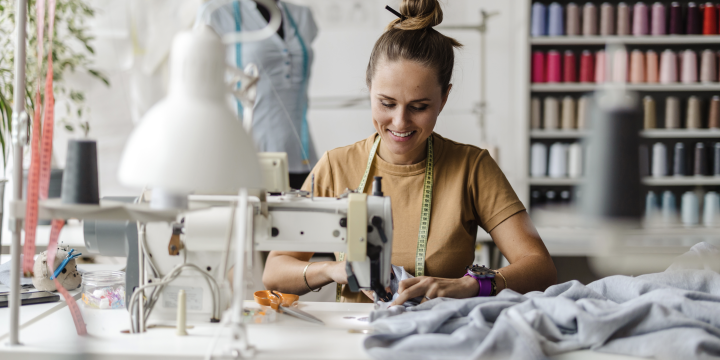 A woman sitting at a sewing machine