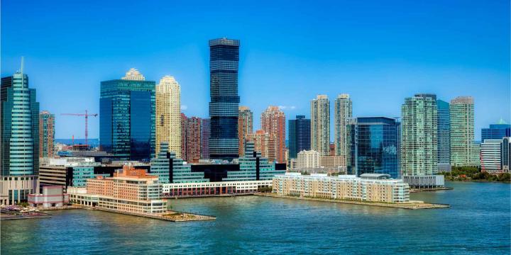 panoramic image of city buildings along a waterfront