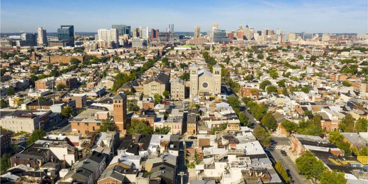 aerial view of boston with housing and city skyline in background