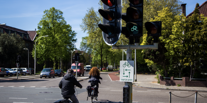 cyclists navigate two-phase turn on dutch intersection