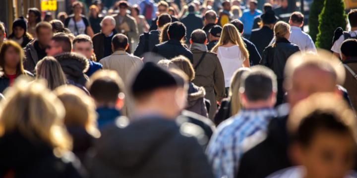 crowd walking on city sidewalk for urban planning course