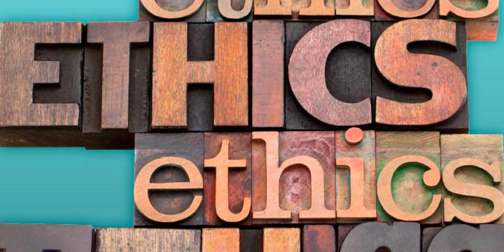 wood carved letters spelling out ethics