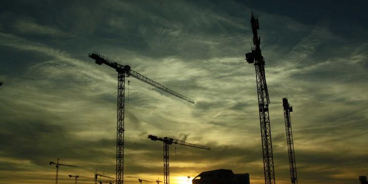 several cranes on construction site