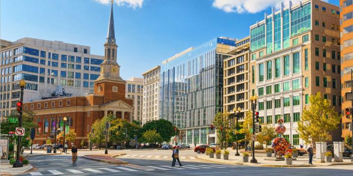 church surrounded by city buildings