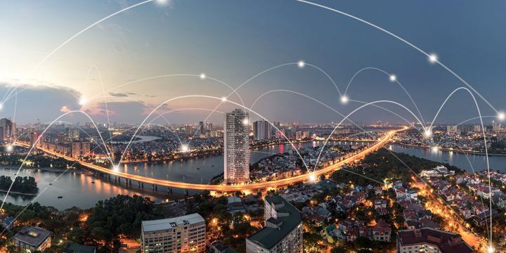 digital network connections over city skyline