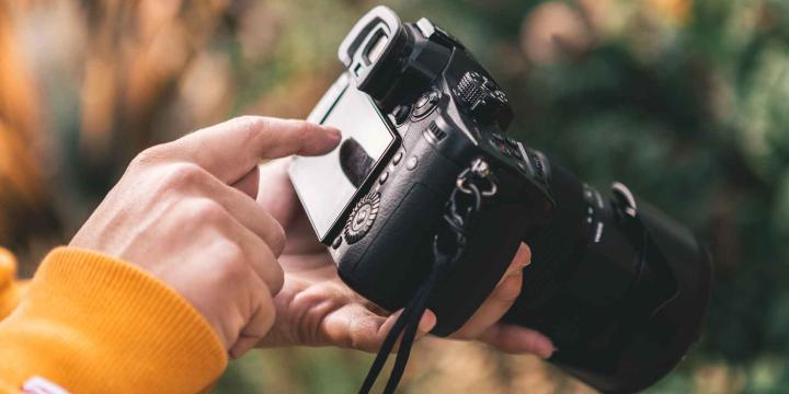 person holding video camera