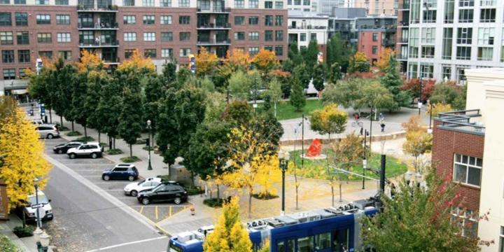 neighborhood with buildings and metro train
