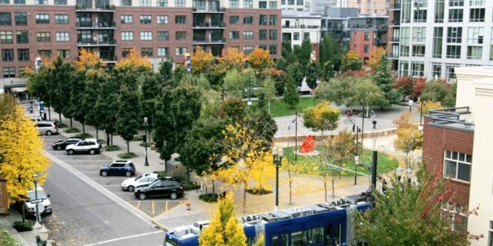 neighborhood with buildings and metro train