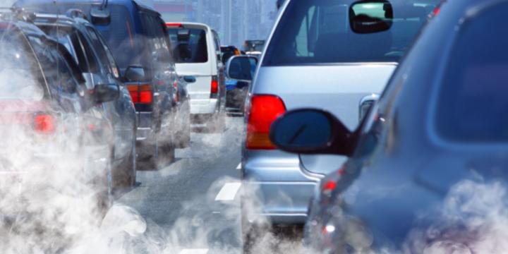 cars in traffic emitting pollution