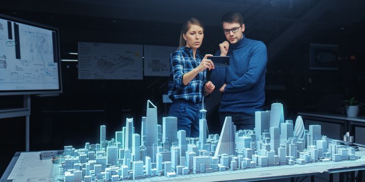 Enhancing Public Participation with Generative AI course image of two people standing over a blue city diagram with the women holding up a cell phone