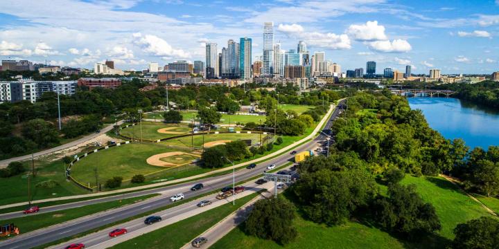 wide angle shot of Austin Texas with a freeway and city skyline