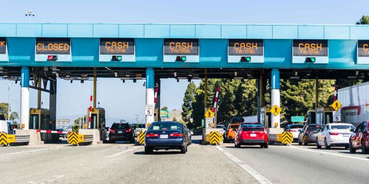cars waiting at a toll road