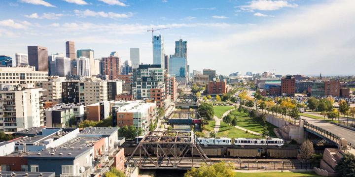 aerial of denver with buildings and transit