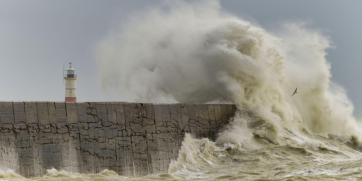 Waves impact breakwater